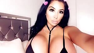Huge tits in a black bikini
