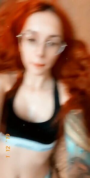 Hot tattooed redhead