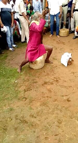 Old man lifting a 70kg rock with his dick