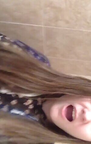 In bathroom, with toothbrush