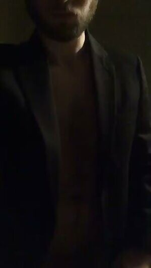 Black suit. White cock. Turn your brightness up.