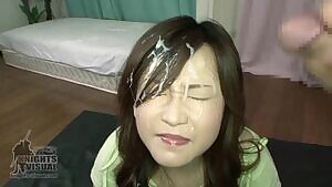 Eyes closed and grimacing