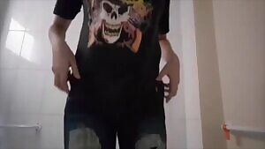 She strips in the bathroom