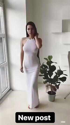 Poking thought the tight white dress