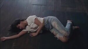 Selena Gomez in a tight white shirt rolling on the floor!