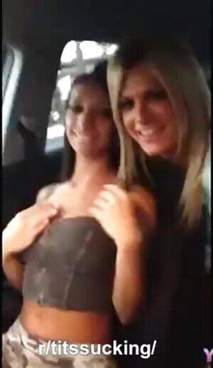 Lesbian sucking tits in car