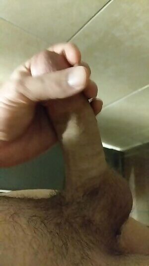 Stroking in the men's room at work