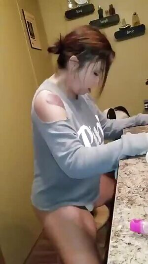 on a stool riding a dildo!