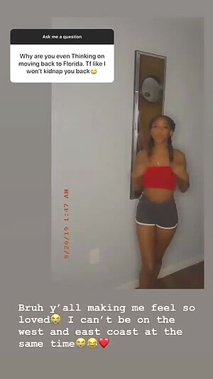 My 19 year old cousin In a red top and gray shorts