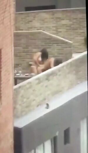 Girls fucking on a balcony