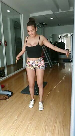 A simple open front top for working out would solve this young ladies problem.