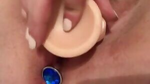 In and out of pussy with plug installed