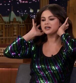 Selena Gomez doing things with her hair