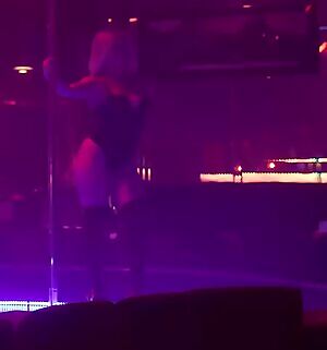 Actress Victoria Baldesarra dancing around a strip pole