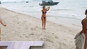 Kelly showing her backflip and booty