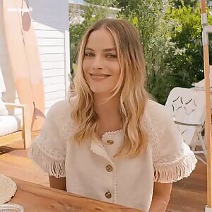 You can’t help but notice Margot Robbie eyeing you while her husband blabbers on obliviously