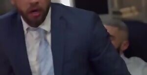 My tailor trying to fit me into my new dress pants