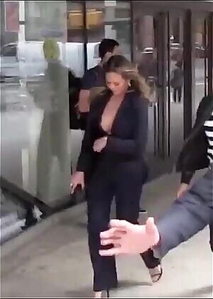 Chrissy Teigen bouncy in huge cleavage
