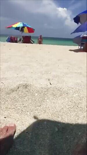 Walking back to her spot on the beach