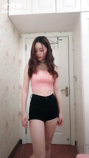 Cute Chinese girl with nice body dancing