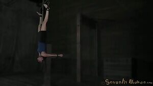 Casey hung upside down in strict bondage, with a dildo inside her pussy, a vibrator on her clit and a cock deep in her throat. She screams as the orgasm takes over her body.