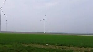 Punk chick sucks next to a wind turbine
