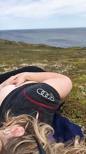 Busty giving head outdoor