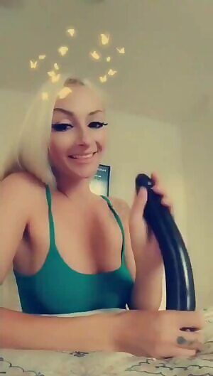 Gorgeous blonde takes a huge black dildo