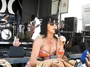 Katy Perry's tits almost pop out.