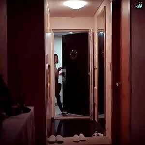 Krystal taking off her bra