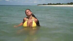 Wendy Fiore in a yellow bikini.