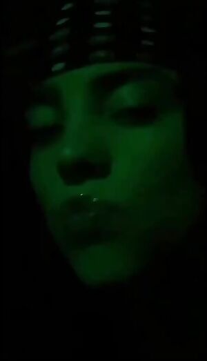 Billie Eilish with lip gloss