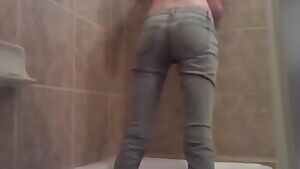 Wetting her jeans in the tub