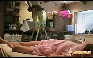 Naughty slut lazes around naked next to the worker