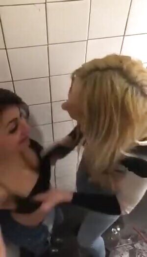 Two girls at toilet have fun again