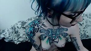 applying lipstick to a dildo