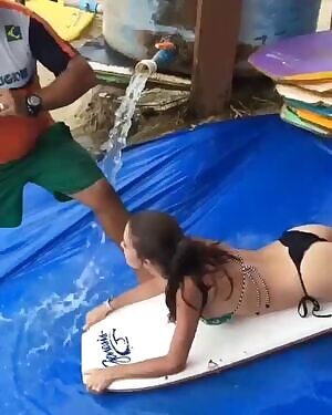 Sliding down a ramp in a bikini