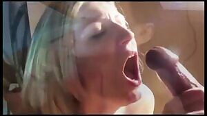 Gently jerks out a monster load on her face and tongue