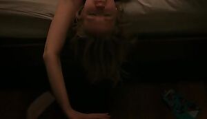 Anna Camp plotted right off the side of the bed