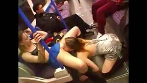 Train conductor gives the thumbs up to two girls going at it in the metro...
