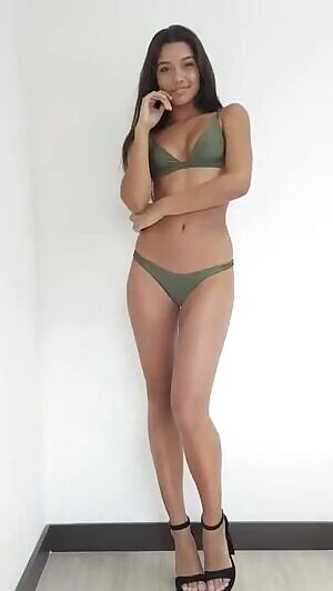 Brunette in green lingerie kiss and wave