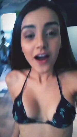 She's back, she's in a bikini, and she's taking photos.