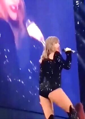 Taylor Swift wagging her beautiful ass, inviting you to steady her full cheeks with your cock.