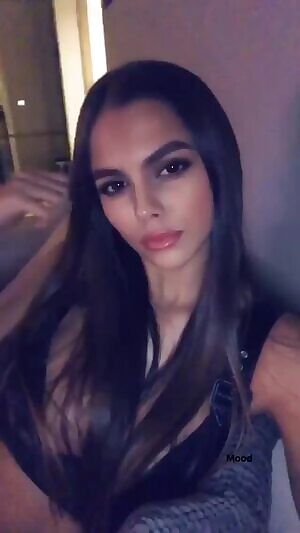 Playing with her hair