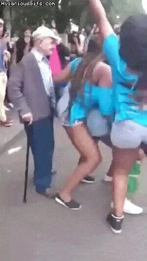 Girls on the street twerking and grandfather with a stick!