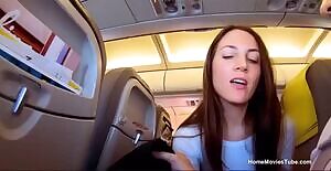 Naughty girl swallows on a crowded plane