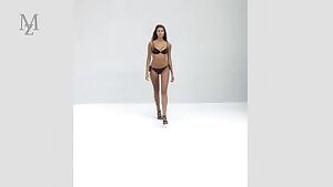 Long-haired brunette in black bikini