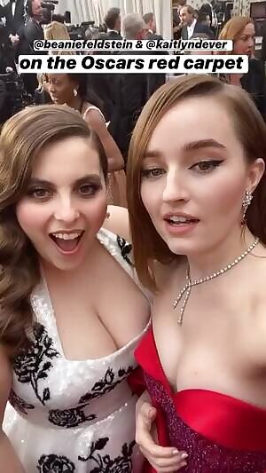 I'm pretty sure Kaitlyn Dever wants to bury her sweet face in Beanie Feldstein's delicious cleavage as badly as I do. She's eye-fucking those fat jugs every chance she gets. I'd love to take one of Beanie's massive tits in my mouth while Kaitlyn tends to the other.