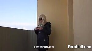 smoking and masturbating on a public balcony