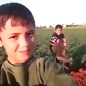 Kids playing with an AK-47